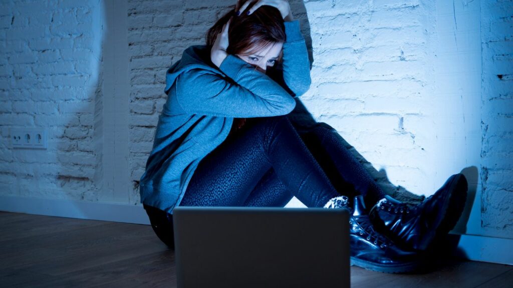 girl watching horror movie